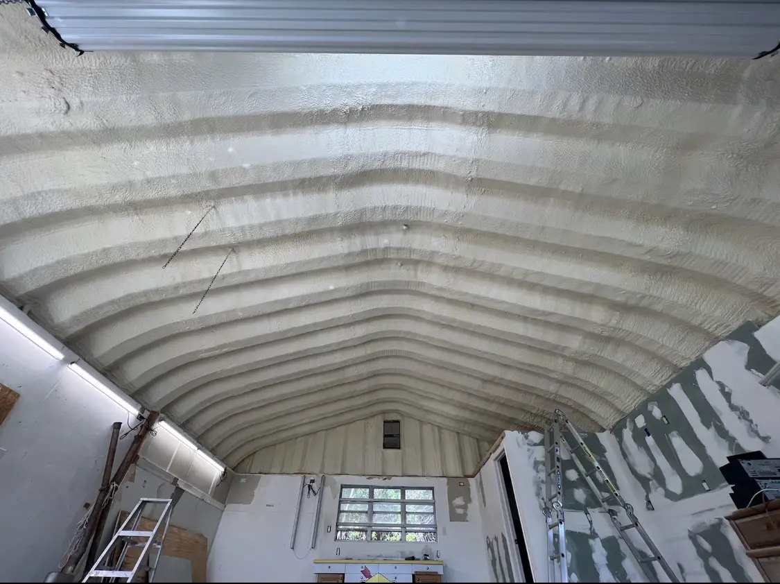 Spray polyurethane foam applied to the underside of a metal roof deck in Unity